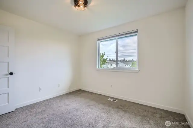 Third bedroom easily fits full-size bed. Don't miss out the treat of having a view of Mount Rainier from this room!