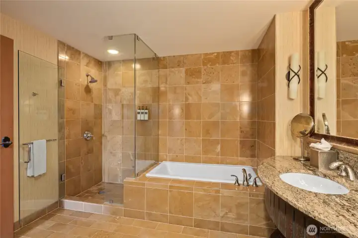 bathroom with soaking tub and shower