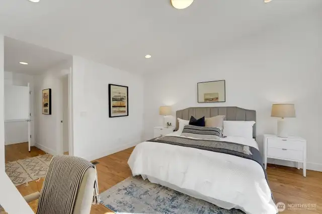 Primary with view towards ensuite bath on right