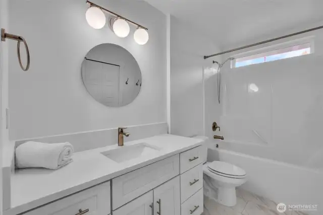 second floor full bath, quartz counter tops ceramic tile floor