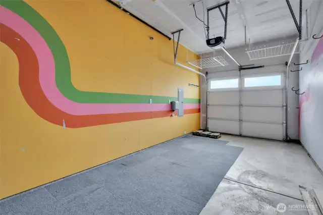 garage with ceiling racks and utility area (not visible)