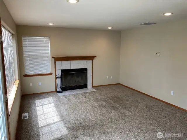 Family room with wood burning fireplace
