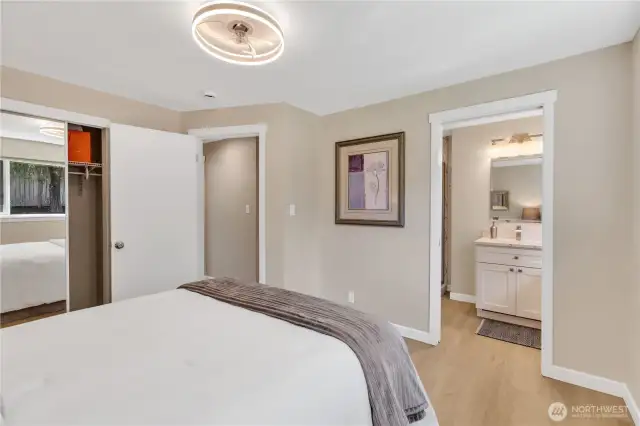 Room for additional furniture - dresser, armoire, bench. Pocket door to Primary bath with heated floors.  Cabinet with quartz countertops, window and vent/fan.