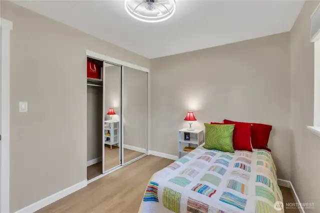 Every bedroom has a roomy closet with by-pass doors for space efficiency.  Every bedroom also has a ceiling light fixture with a built-in dual direction fan.