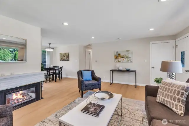 Gas fireplace for chilly nights!  Open concept works with lots of options for seating, big screen tv, as well as art.