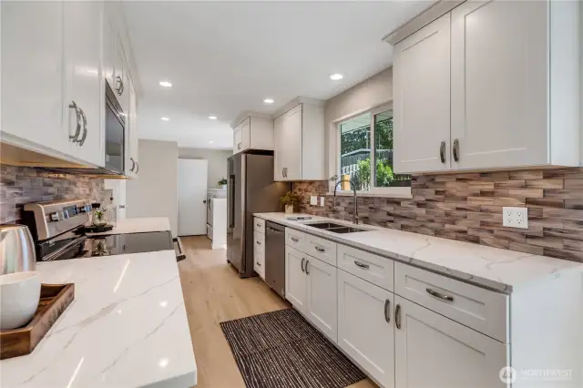 Stainless appliances and a deep 2-bay sink make this kitchen efficient and a delight to prepare meals.  Expansive counter space for serving, Holiday baking, and room for extra help in the kitchen!