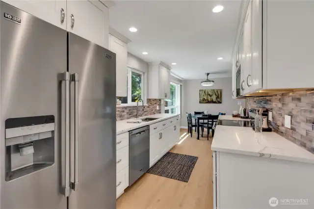 Clean lines, under counter lighting, smooth-top cooking range/oven, fully vented microwave.