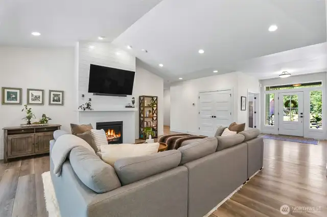 Living room space comes with the large TV, sit and relax by the fireplace