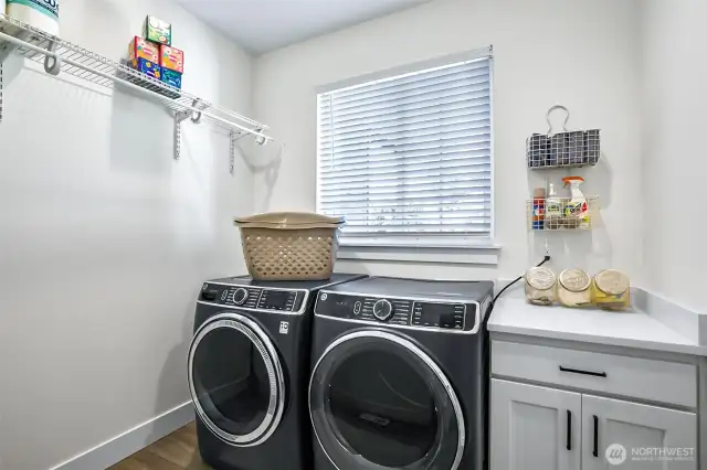 Great sized laundry room with room to fold and hang clothing. Comes with this high end washer and dryer set