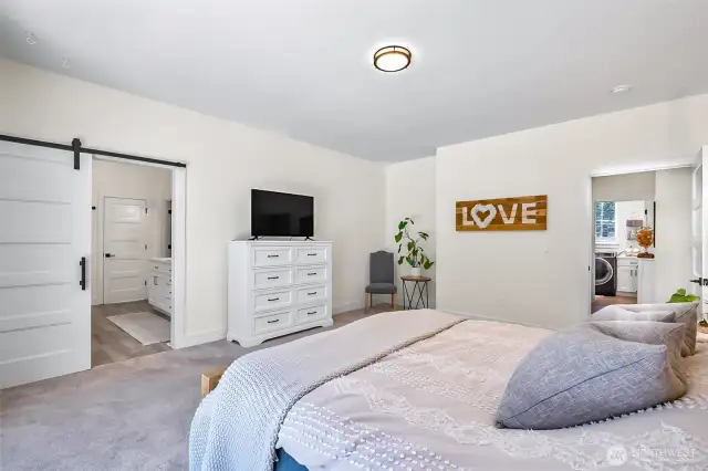 Easy access right to laundry room, barn doors to your ensuite bathroom