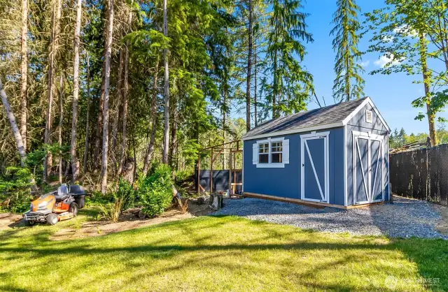 Custom chicken coop with outdoor grazing, extra storage inside, matches the home perfectly. And a picture of the riding lawnmower which comes with home. Oh did I mention that the laying chickens come with the home too, no more paying too much for eggs you will have your own!