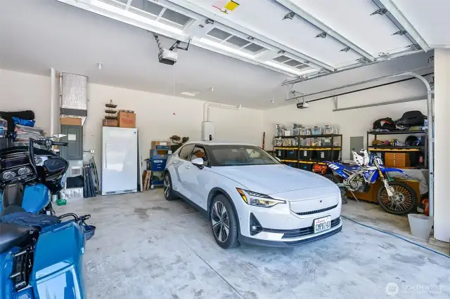 Large, clean 3 car garage with EV charger