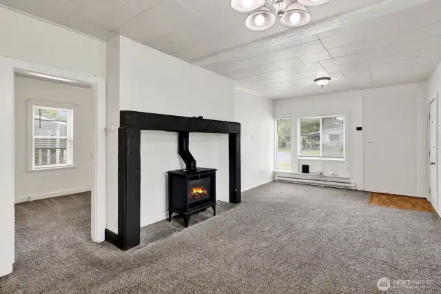 Living room with an area for dining table that backs to the kitchen.