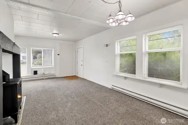 Living room with an area for dining table that backs to the kitchen.