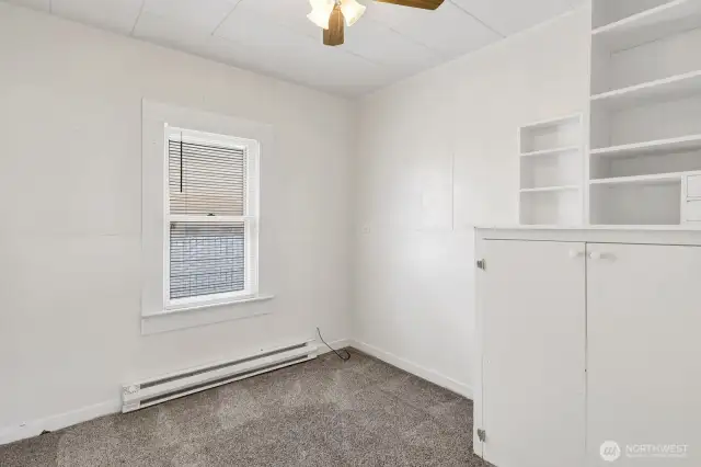 Second Bedroom with built in closet with shelving.