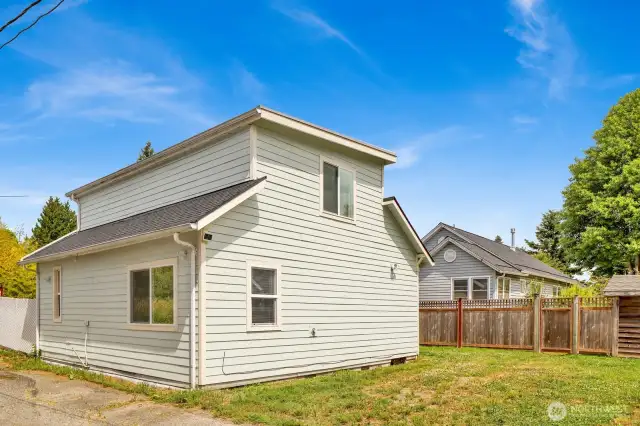 Unit #2 with alley access and off street parking, fence provides privacy between the homes.