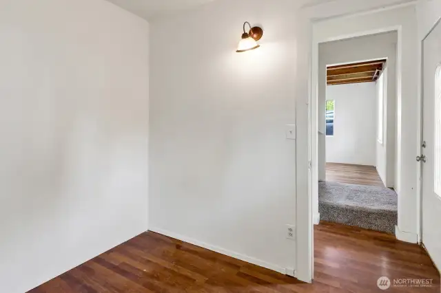 Office off the front entry with engineered flooring on this side of the home and continues to the two upstairs bedrooms.