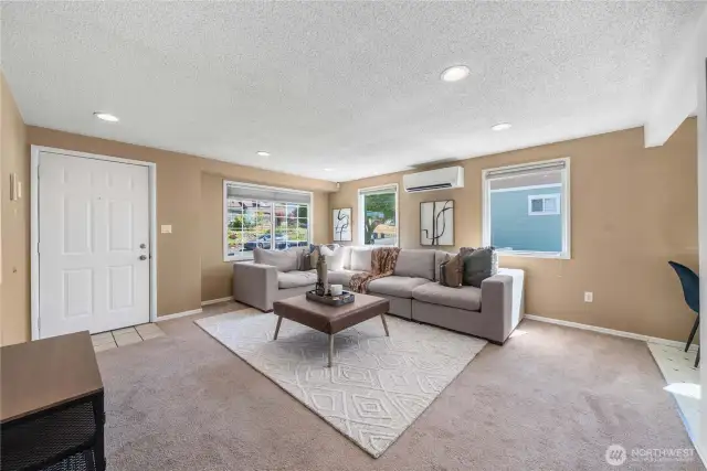 Open floor plan between living space and kitchen area