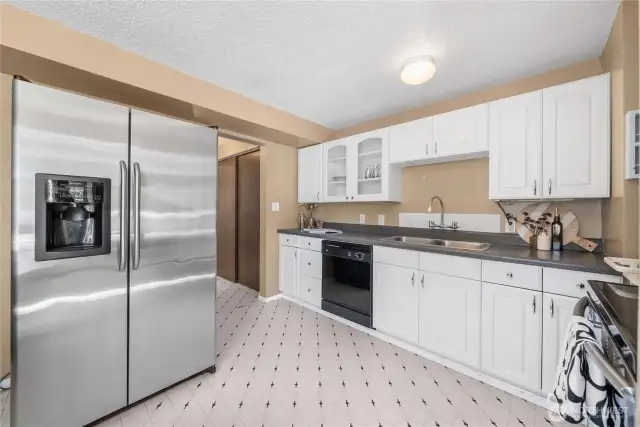 White kitchen cabinets and plenty of storage!
