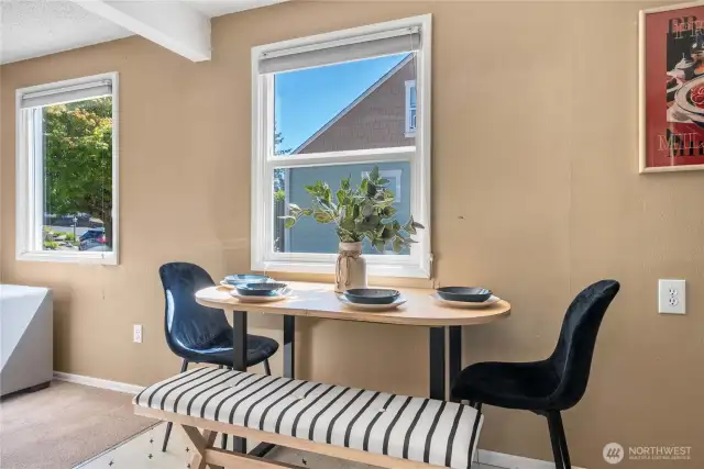 Dining area seamlessly connected to living room and kitchen