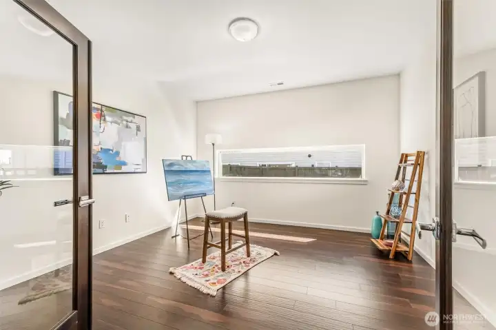 French doors lead into this flexible room for office, art studio space.
