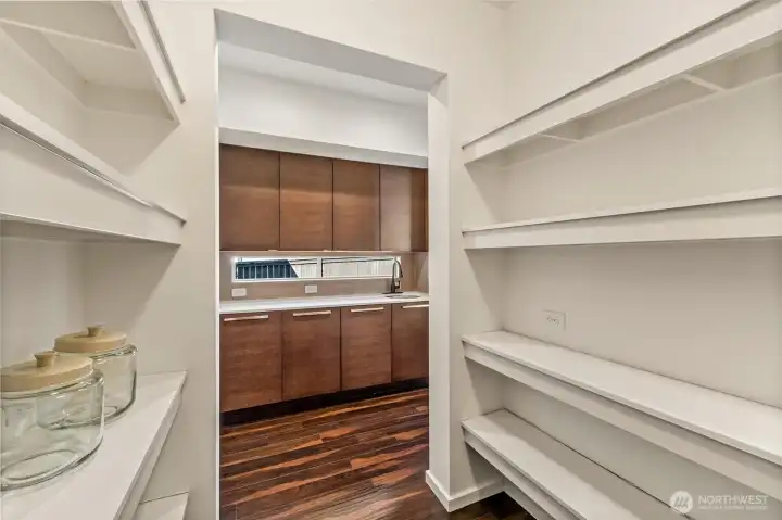 Just around the corner from the kitchen is the walk-in oversized pantry for even your biggest trips to Costco
