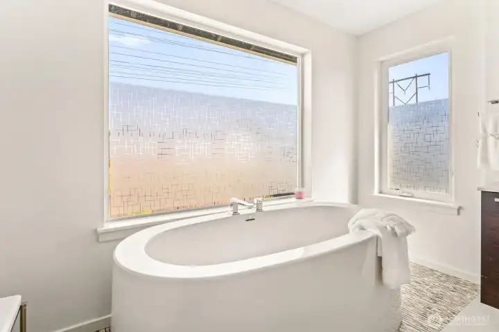 Giant stand alone soaking tub on your luxurious ensuite primary bath