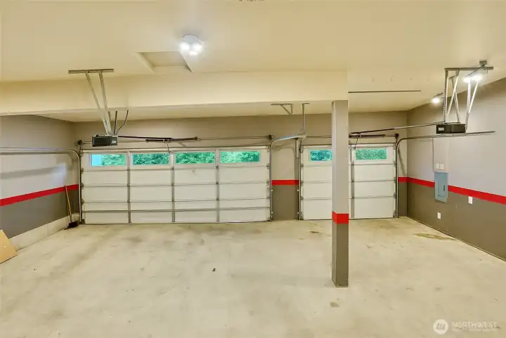 Three car garage with tall ceilings and lots more room for storage.