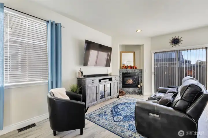 Livingroom area with sliding doors leading to back patio & yard