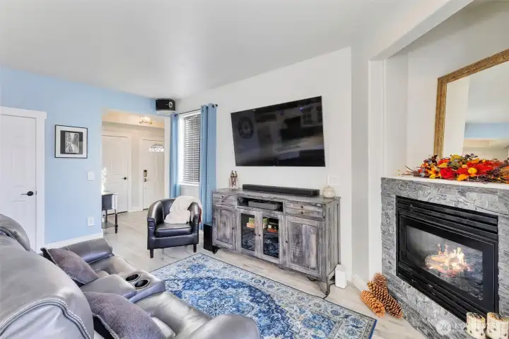 Views of entry frontdoor, garage and 1/2 bath on main