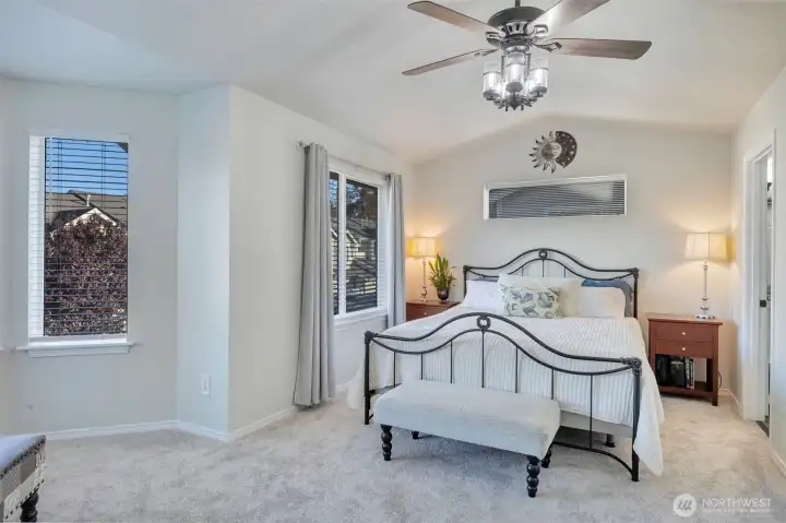 Primary has vaulted ceilings, ceiling fan/light, new paint and lots of natural light