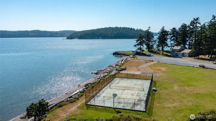 Membership in the Hope Island Beach Club includes private beach, boat launch, tennis/pickleball court and clubhouse.