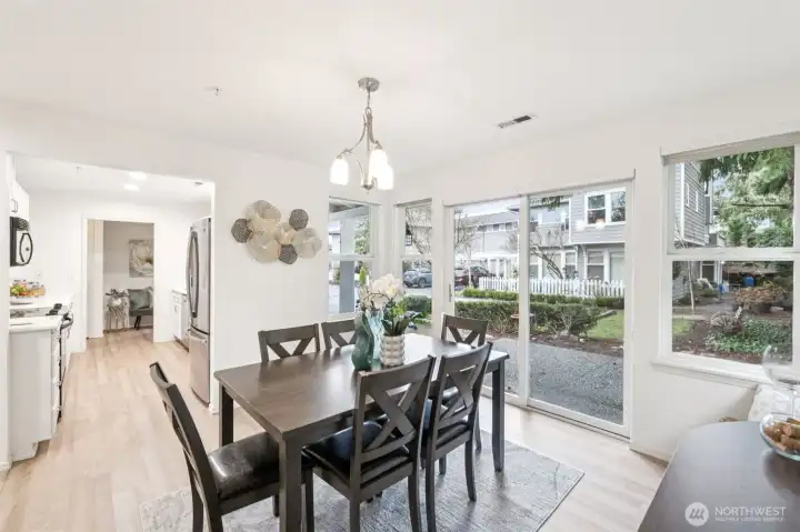 Great space just off kitchen with great natural light and slider to patio.