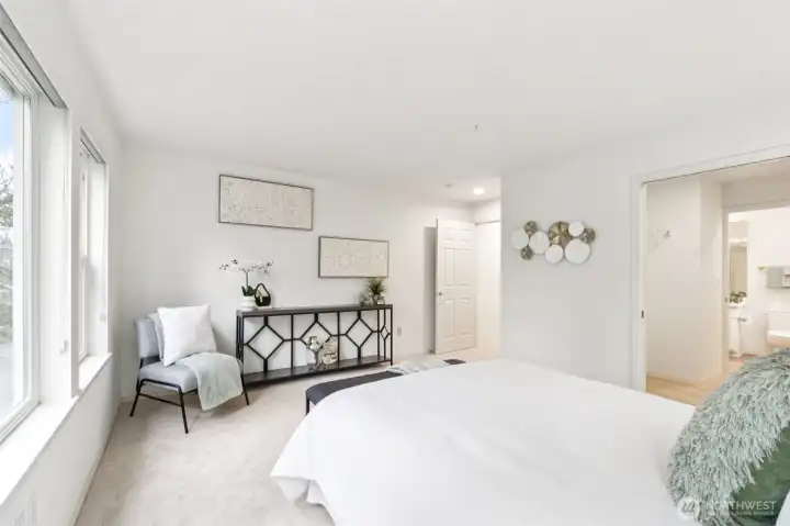 Another view of primary showing entrance to walk-in closet/bathroom