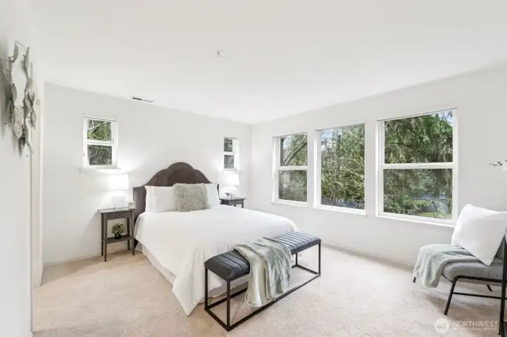 Upper floor spacious view   bedroom with lots of windows.