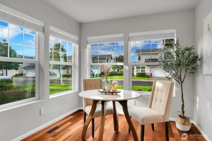 Natural light floods the eating area off the kitchen.