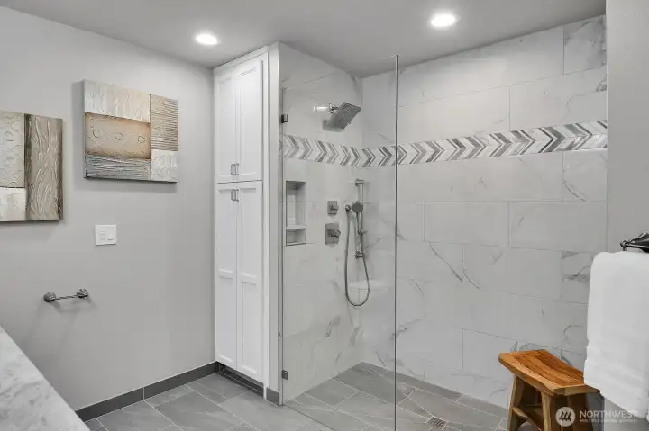 Totally remodeled Primary bath with addition of accessible double shower & linen closet.