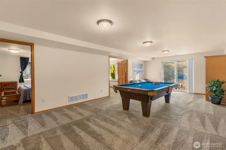 Large rec room that opens to the lower patio