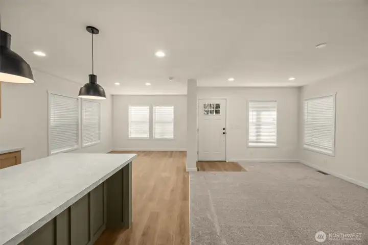 Seamless flow between living, dining, and kitchen spaces