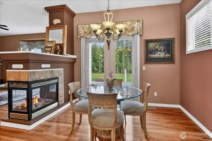 Imagine lunch or a card game next to this three-sided gas fireplace and gazing through the single light French Doors at the golf course and green forest beyond. Imagine lunch or a card game next to this three-sided gas fireplace and gazing through the single light French Doors at the golf course and green forest beyond.