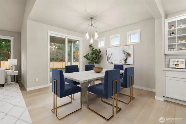 Dining Room with hardwood floors and access to back patio.