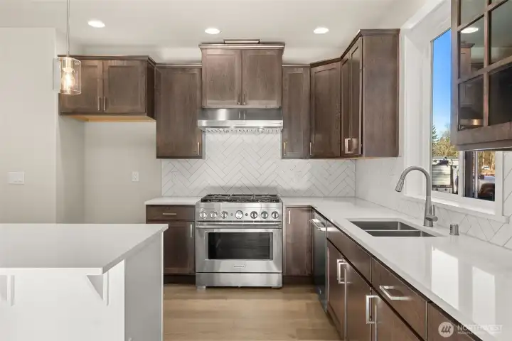 Another angle of the kitchen. Underwount sink, quartz counters, soft close cabinets, KitchenAid appliances.