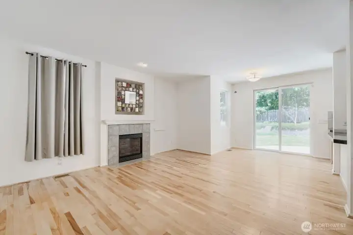 Living room with breakfast nook which leads you to fully landscaped private back patio Living room with breakfast nook which leads you to fully landscaped private back patio