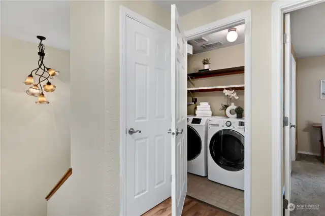 This upstairs utility room features modern appliances and a spacious storage - perfect for all your household storage needs. Its convenient location near the bedrooms ensures easy access and efficient laundry use.
