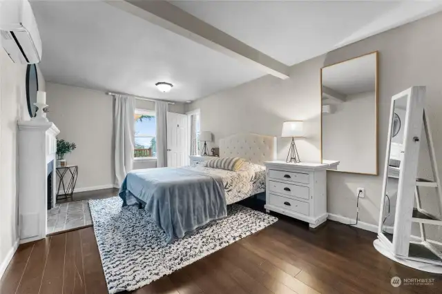 Main floor Primary with wood burning fireplace