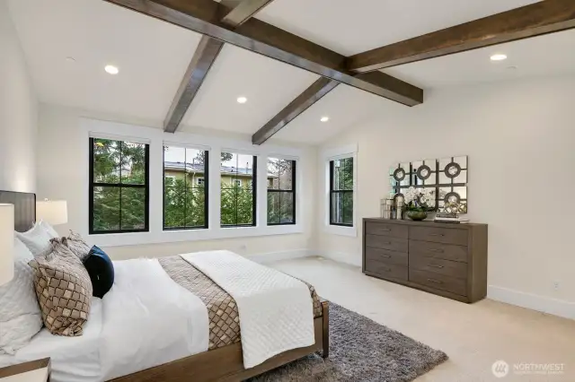 Primary suite with accented beams + detail