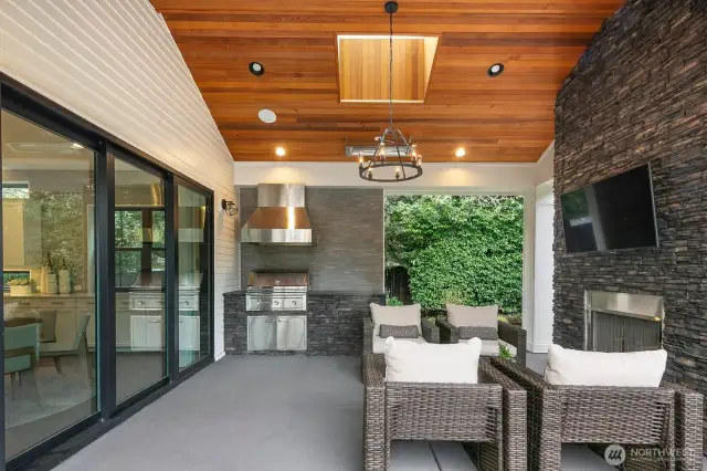 Covered patio with fireplace, heat lamps and bui-in-BBQ