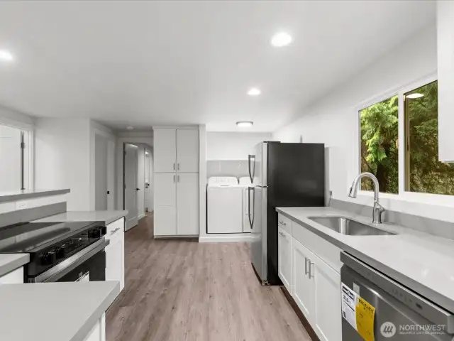 Through the Kitchen to handy Laundry and pantry or extra storage cabinet.