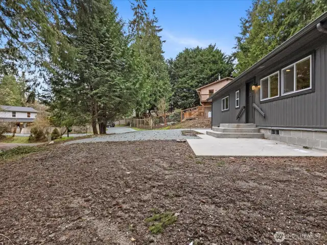 Patio and garden area off the front steps .