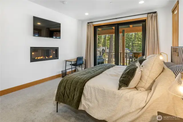 Primary Bedroom with slider to deck, and fireplace.